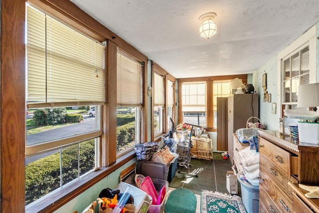 121 Purchase St, Milford, MA 01757 - sunroom / solarium featuring a textured ceiling and concrete flooring