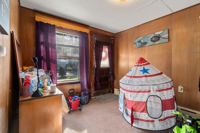 121 Purchase St, Milford, MA 01757 - recreation room with carpet, wooden walls, a baseboard radiator, and a baseboard heating unit