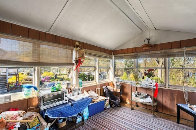 121 Purchase St, Milford, MA 01757 - sunroom with lofted ceiling, carpet floors, plenty of natural light, and wood walls