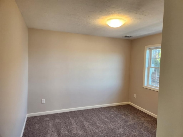 unfurnished room with carpet flooring