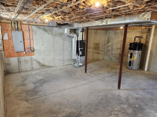 basement featuring heating unit, heat pump water heater, and electric panel