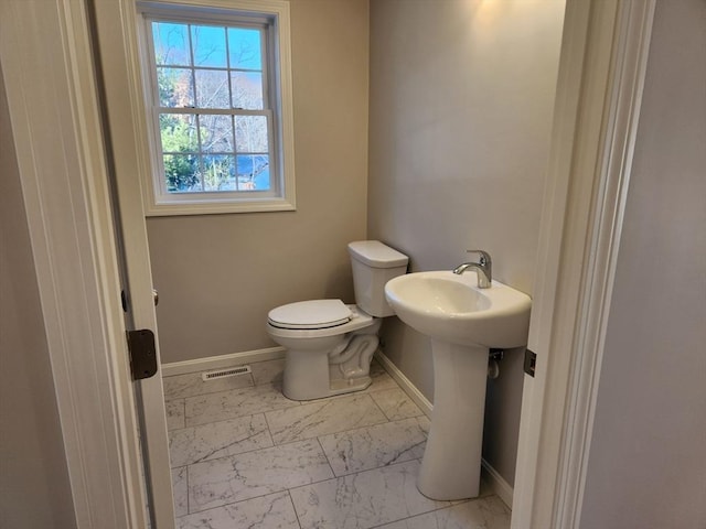 bathroom with sink and toilet