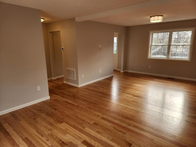 unfurnished room featuring light hardwood / wood-style flooring