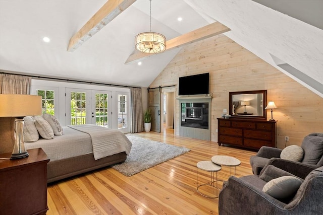 bedroom featuring high vaulted ceiling, light wood-style floors, beam ceiling, and access to exterior