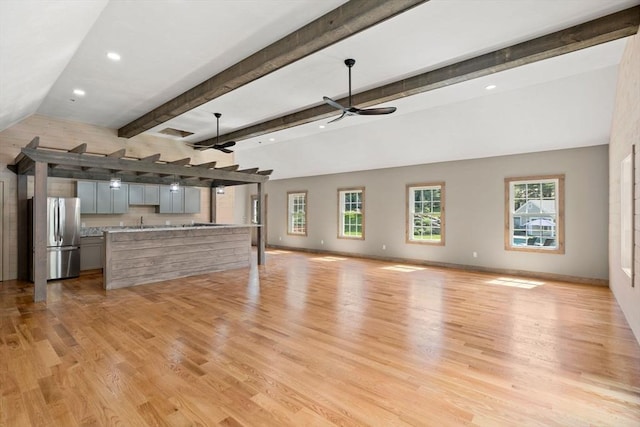 unfurnished living room with ceiling fan, light wood-style floors, recessed lighting, and baseboards