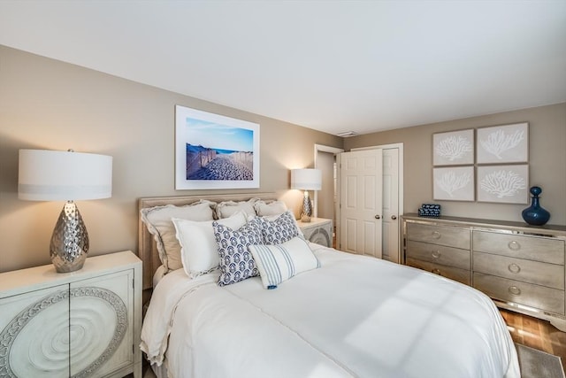 bedroom featuring a closet and wood finished floors