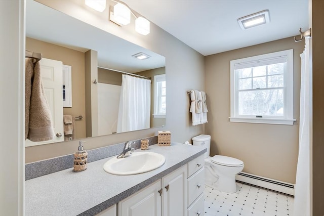 full bath featuring a baseboard heating unit, vanity, toilet, and tile patterned floors