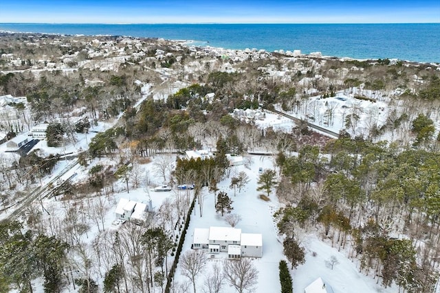 snowy aerial view featuring a water view