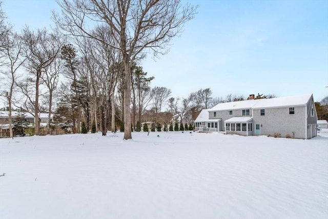 view of yard layered in snow