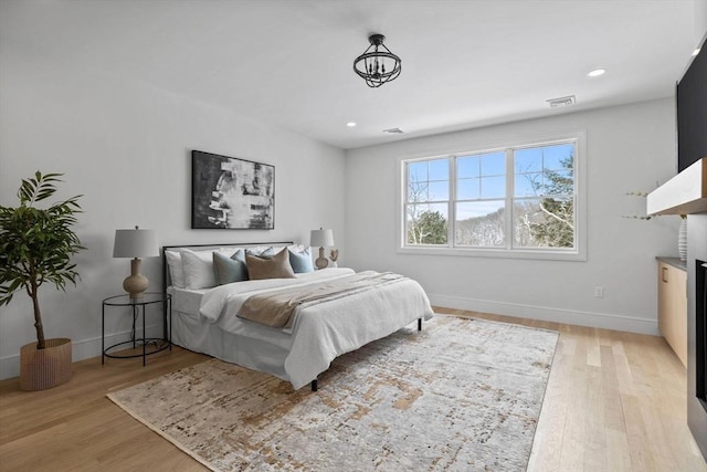 bedroom with light hardwood / wood-style floors