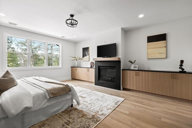 bedroom with light wood-type flooring