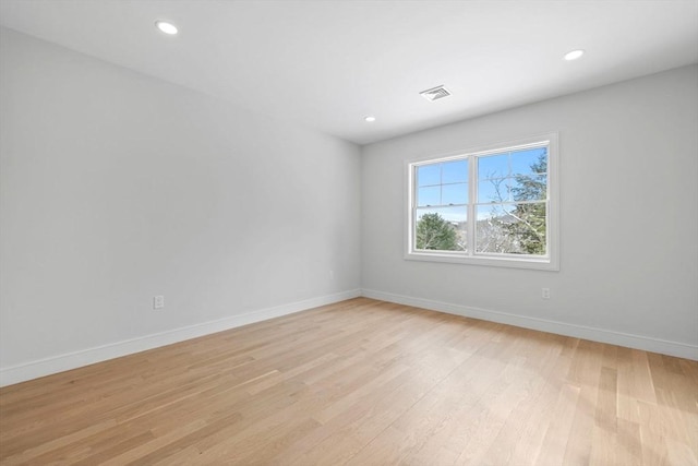 unfurnished room with light hardwood / wood-style flooring