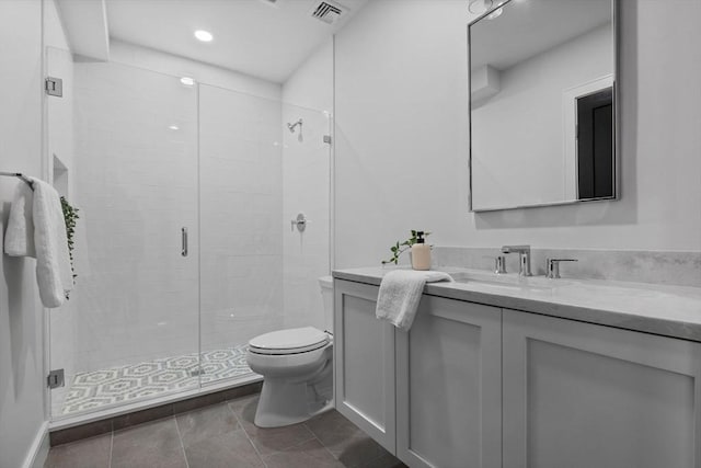 bathroom with a shower with shower door, toilet, and vanity