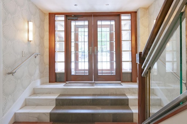 interior space with french doors and wallpapered walls