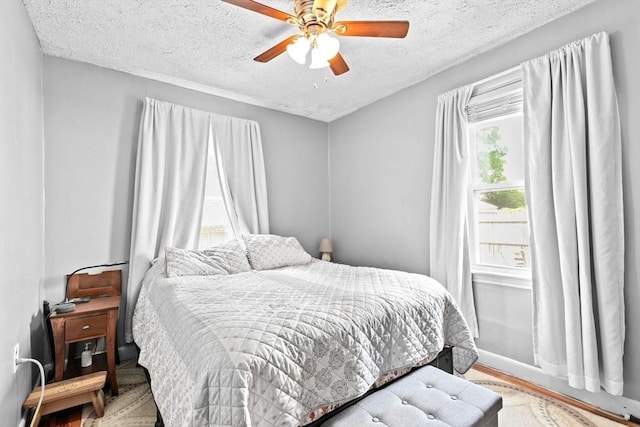 93 Warren, Fall River, MA 02721 - bedroom with a textured ceiling, wood finished floors, and ceiling fan