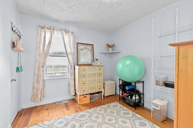 93 Warren, Fall River, MA 02721 - home office with plenty of natural light, wood finished floors, a textured ceiling, and baseboards