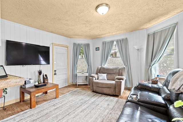 93 Warren, Fall River, MA 02721 - living area featuring a textured ceiling and wood finished floors