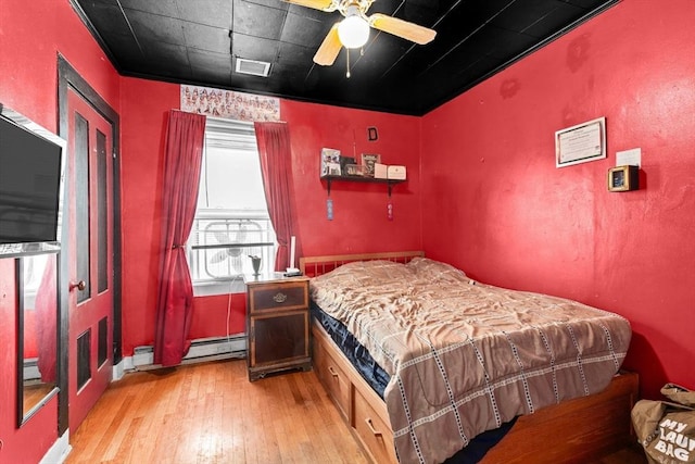 93 Warren, Fall River, MA 02721 - bedroom featuring light wood finished floors, a baseboard heating unit, and ceiling fan