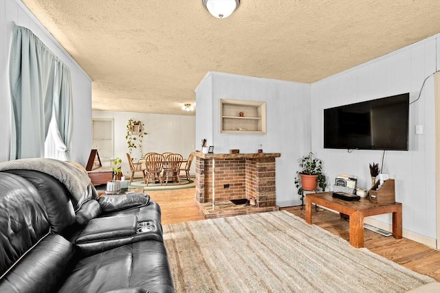93 Warren, Fall River, MA 02721 - living area with wood finished floors, a textured ceiling, and baseboards