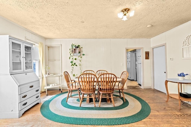 93 Warren, Fall River, MA 02721 - dining room with light wood-type flooring and a textured ceiling