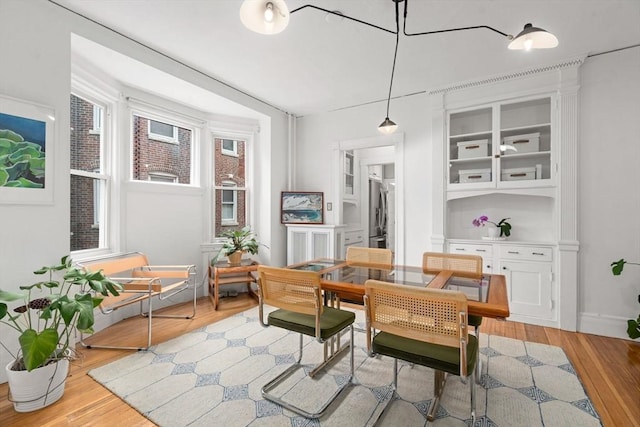 dining area with light wood-type flooring