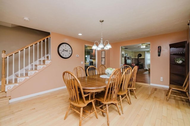 36 Hope, Seekonk, MA 02771 - dining space featuring baseboards, recessed lighting, stairway, light wood-style flooring, and ceiling fan with notable chandelier