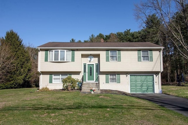 272 S Precinct, Taunton, MA 02718 - raised ranch with aphalt driveway, entry steps, a front lawn, a chimney, and a garage