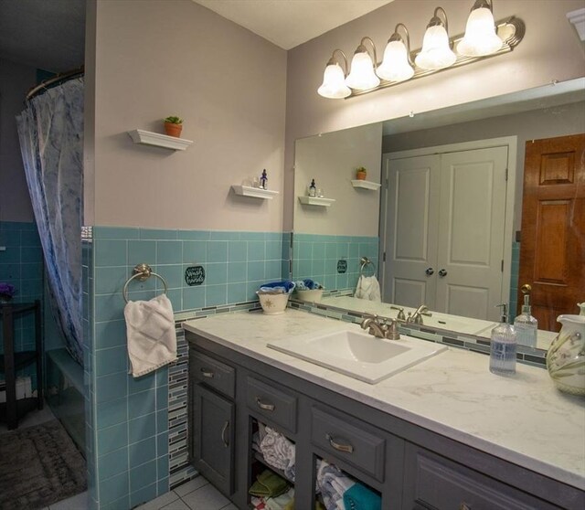 272 S Precinct, Taunton, MA 02718 - full bath with tile patterned floors, tile walls, vanity, and wainscoting
