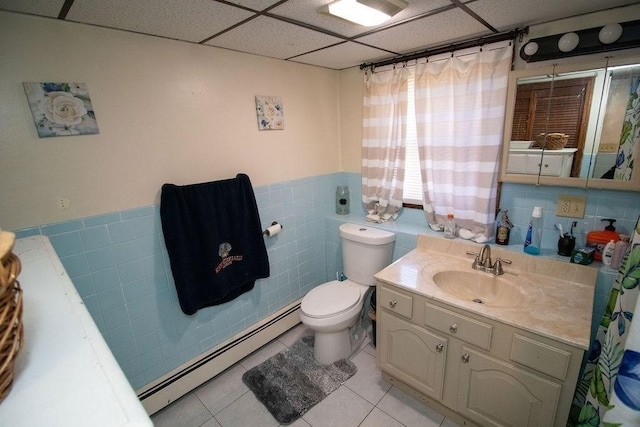272 S Precinct, Taunton, MA 02718 - bathroom with toilet, tile walls, a baseboard radiator, wainscoting, and tile patterned flooring