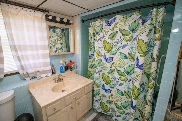 272 S Precinct, Taunton, MA 02718 - full bathroom featuring a paneled ceiling, vanity, toilet, a shower with shower curtain, and tile walls