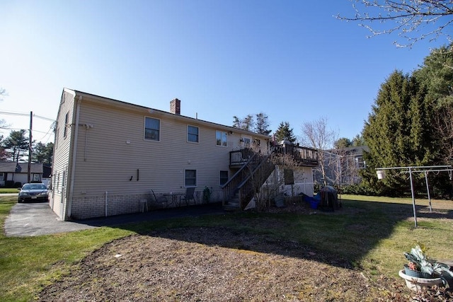 272 S Precinct, Taunton, MA 02718 - rear view of house with stairs, a wooden deck, a chimney, and a lawn