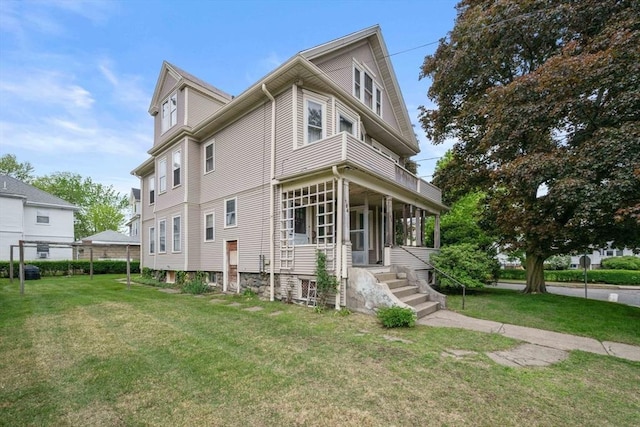 164-166 Church St, Watertown, MA 02472 - view of side of home with a lawn and a balcony