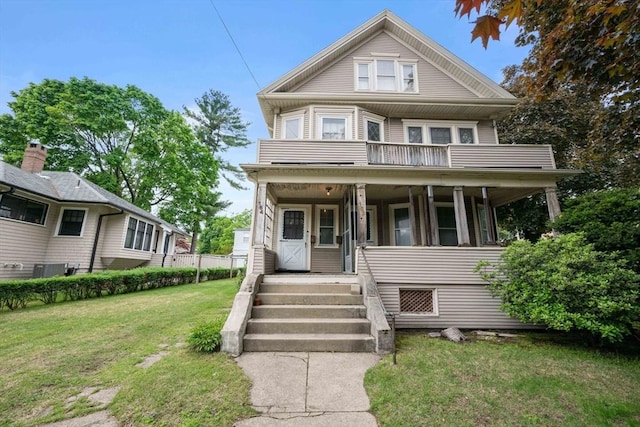 164-166 Church St, Watertown, MA 02472 - american foursquare style home featuring a front lawn, covered porch, and a balcony