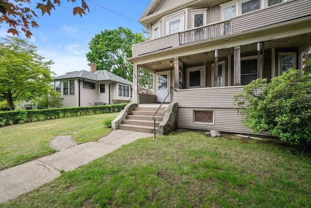 164-166 Church St, Watertown, MA 02472 - view of front facade with a balcony, a front yard, and covered porch