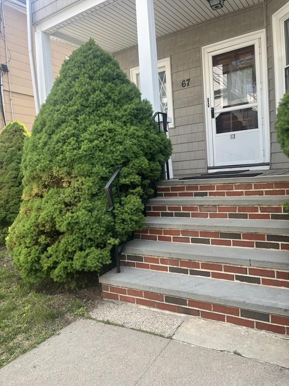 67 Etna St, Boston, MA 02135 - doorway to property with a porch