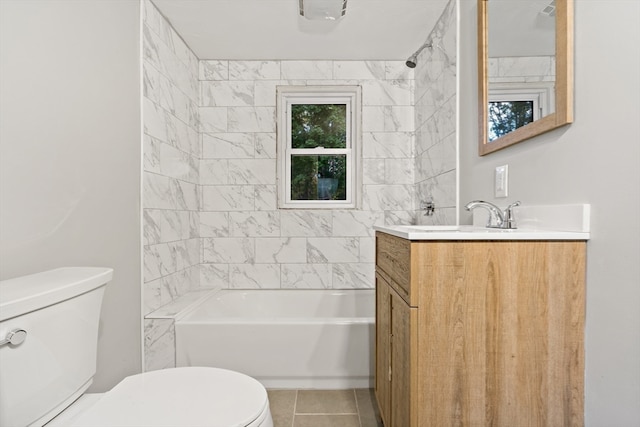 full bathroom featuring vanity, toilet, tile patterned flooring, and tiled shower / bath