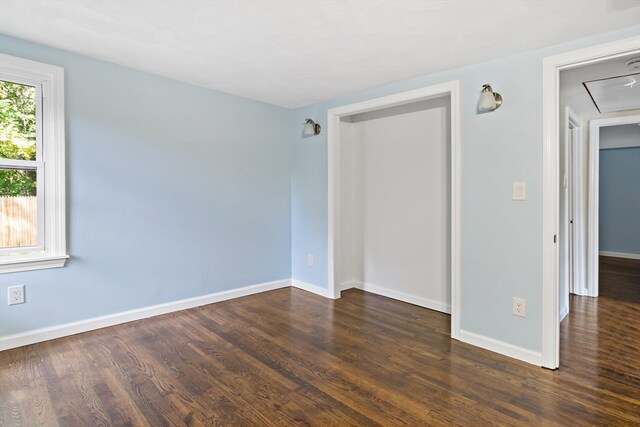 spare room featuring dark hardwood / wood-style flooring