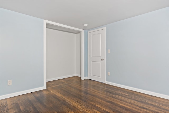 spare room featuring dark hardwood / wood-style floors