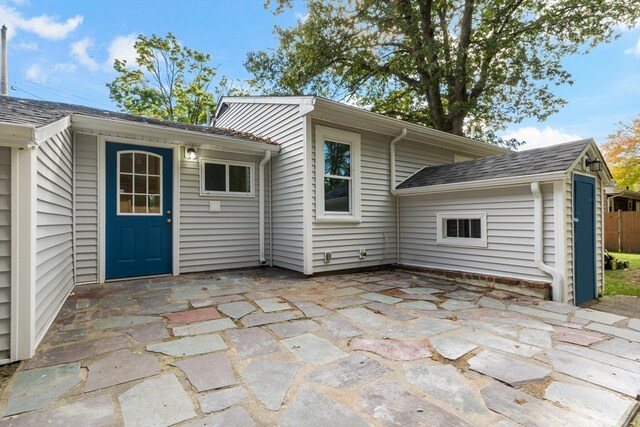 back of house with a patio