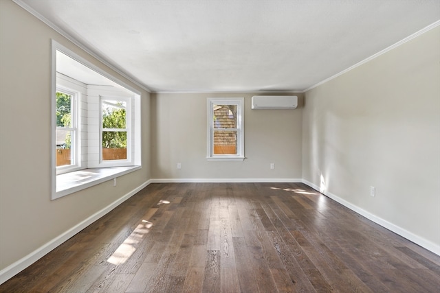 spare room with crown molding, dark hardwood / wood-style floors, and a wall unit AC