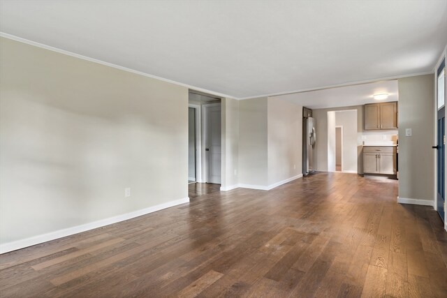 unfurnished living room featuring crown molding and dark hardwood / wood-style floors