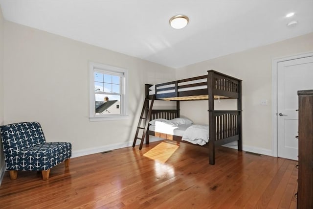 bedroom with hardwood / wood-style floors