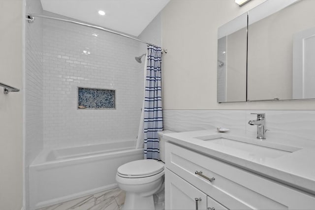 full bathroom featuring shower / bath combination with curtain, toilet, tile walls, and vanity