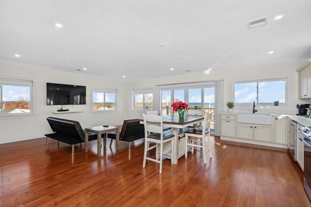 dining room featuring hardwood / wood-style flooring and sink