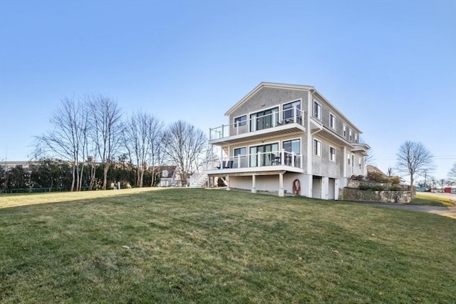 rear view of property with a lawn