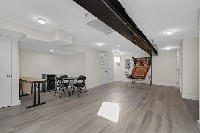 interior space with light wood-type flooring and electric panel