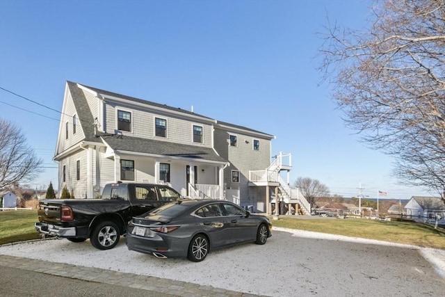 view of front facade with a porch and a front yard