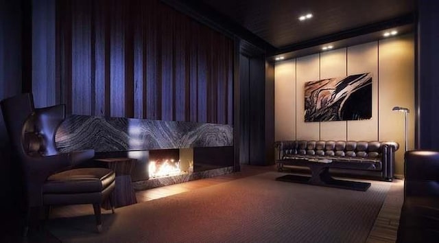 home theater featuring a fireplace and carpet floors