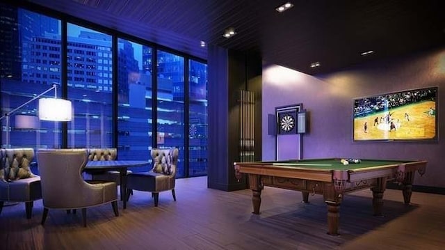 playroom featuring a wall of windows, hardwood / wood-style floors, and billiards