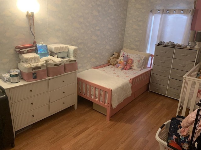 bedroom with light hardwood / wood-style flooring